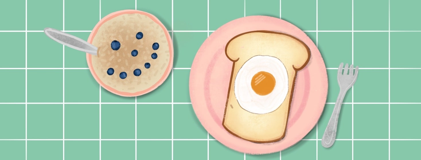 Bowl of oatmeal with a smiley face made out of blueberries and toast with egg