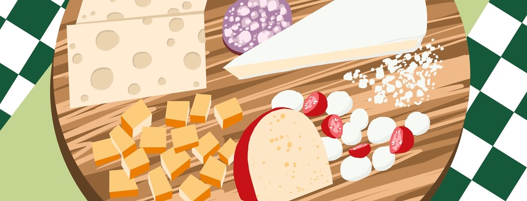 A cheese platter features a variety of cheeses that are listed as low FODMAP foods.