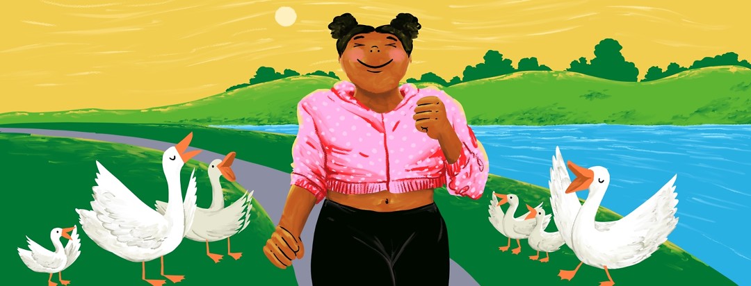 A happy woman proudly strolls along a path next to a river, while ducks on the grass on either side of her cheer her on.