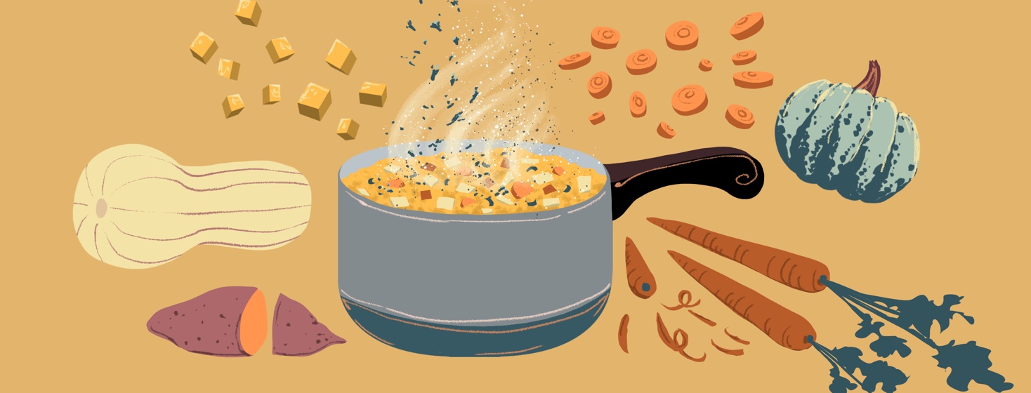 A bowl of steaming soup is surrounded by fall veggies.