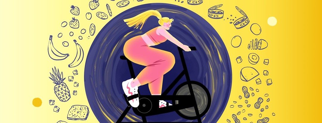 A woman bikes on a stationary bike. Around her are foods to eat before and after a workout.