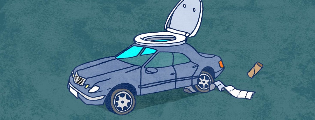 A car is fashioned with a toilet seat on top. Toilet paper trails underneath one of the tires.