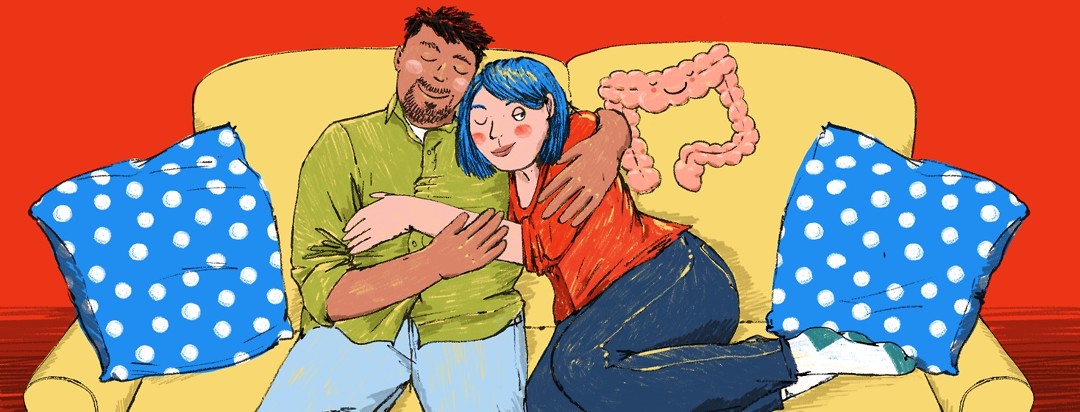 A couple hug each other contently on a couch. The woman has one eye closed and one eye looking suspiciously at a smiling large intestine that seems to be snuggling up to the pair.