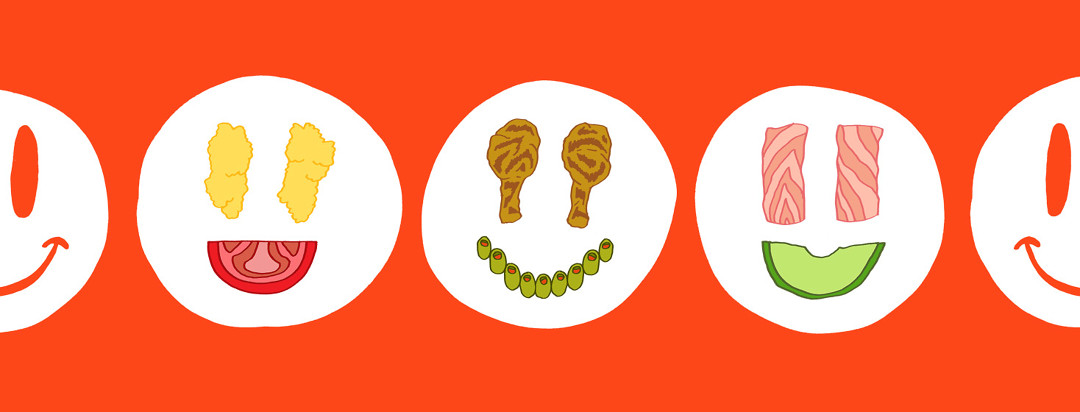 Several different meals on plates form into smiley faces.