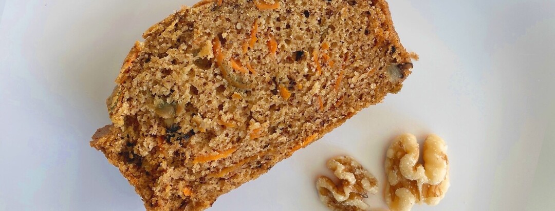 carrot cake with walnut on white plate