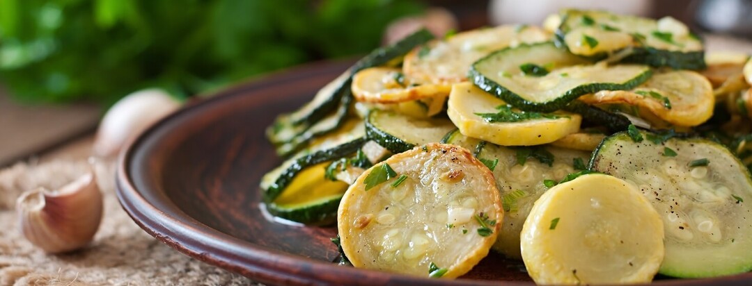 Yellow squash and zucchini on brown plate