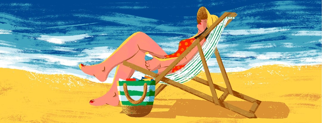 alt=A woman relaxes in a beach chair next to the ocean and a large bag full of items.