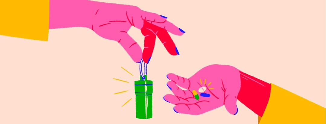 alt=a hand holds a keychain pill case; another hand holds pills in its palm.