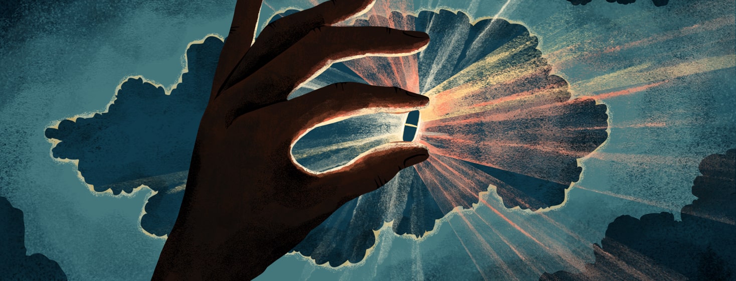 alt=A hand in shadow handles up a pill that is illuminated from behind, emitting rays of light. This is set against a dark sky with a cloud also somewhat illuminated from behind.