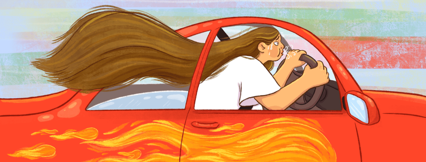 A sweating woman in a car with flames on the side breaths out as she drives, her hair flies out the window