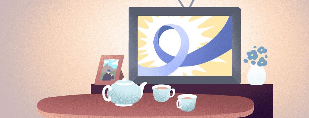 A Irritable bowel syndrome awareness ribbon is displayed on a TV behind a table with a tea set.
