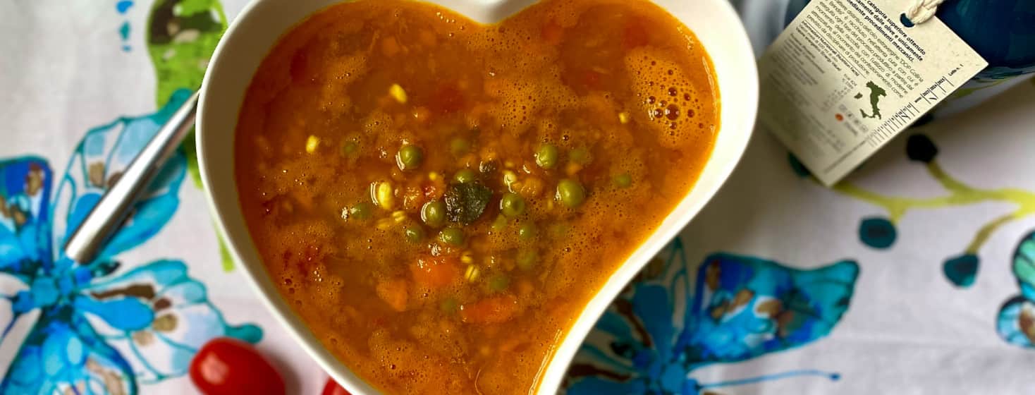 Fall Pumpkin and Veggies Soup in a heart shaped bowl.